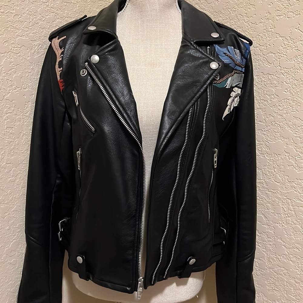 BlankNYC motorcycle jacket . Size L with beautiful embroidery on the back .